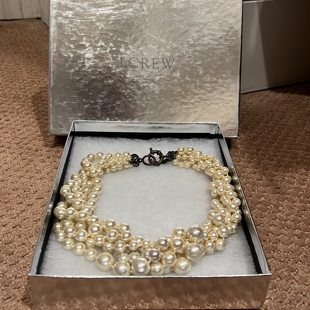 Give strands pearl necklace .